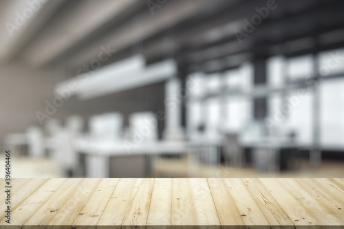 Blank table top made of wooden planks with bright furnished office on background, mockup © Pixels Hunter