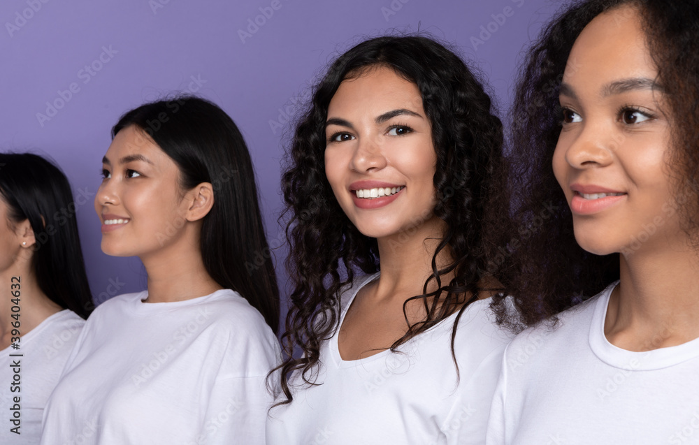 Latin Woman Standing In Row With Multiracial Ladies, Studio Shot Latin Woman Standing In Row With Multiracial Ladies, Studio Shot