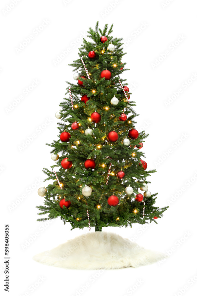 Beautiful decorated Christmas tree with skirt on white background Beautiful decorated Christmas tree with skirt on white background
