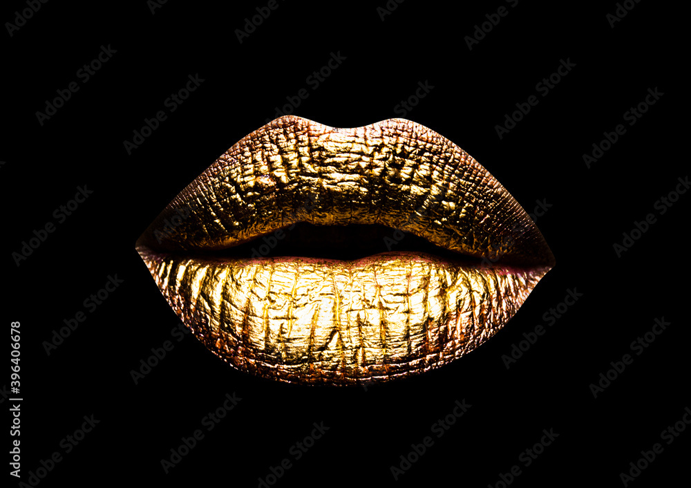 Gold lip. Closeup view of sexual beautiful female closed golden lips  isolated on black background. Stock Photo | Adobe Stock
