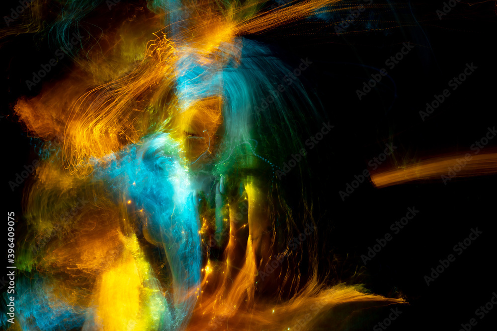 Obraz premium light painting portrait, new art direction, long exposure photo , light drawing at long exposure , abstract photo 