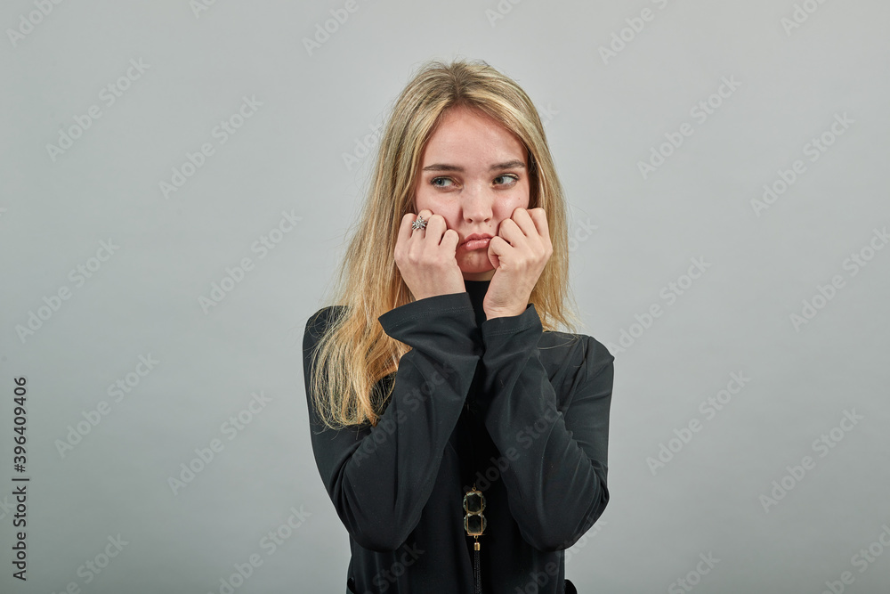 Upset offended looking big eyes, blowing cheeks being annoyed after quarrel with her husband, inflating not wanting to do something, bad mood, fascinating, cut, pouted. Young attractive woman, dressed Upset offended looking big eyes, blowing cheeks being annoyed after quarrel with her husband, inflating not wanting to do something, bad mood, fascinating, cut, pouted. Young attractive woman, dressed