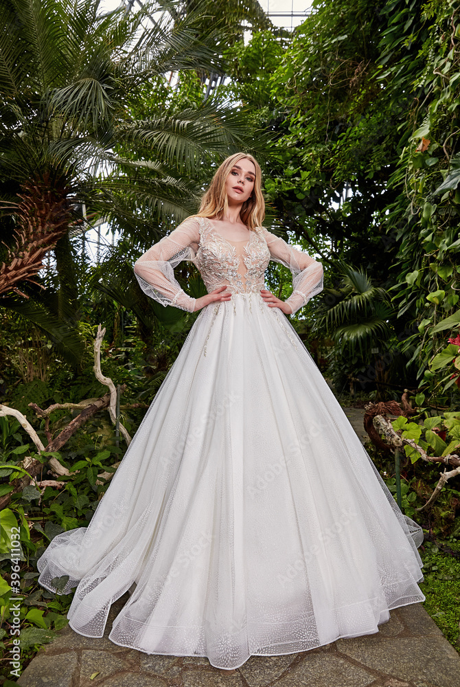 Sexy beautiful woman pretty bride wedding big day marriage ceremony in summer garden wearing long silk and lace white dress bright makeup hairstyle pure love. Sexy beautiful woman pretty bride wedding big day marriage ceremony in summer garden wearing long silk and lace white dress bright makeup hairstyle pure love.