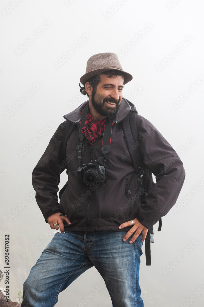 traveler man photographer hat in spectacular landscape crater lake with fog quilotoa volcano ecuador latin america traveler man photographer hat in spectacular landscape crater lake with fog quilotoa volcano ecuador latin america