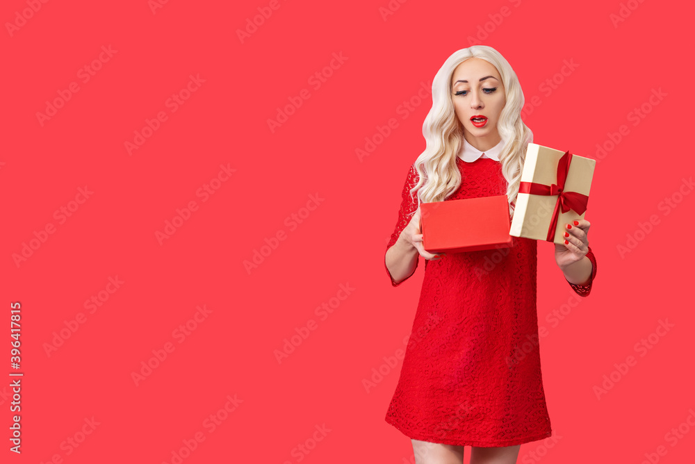 Beautiful girl with long hair with sweets on a red background for Valentine's day Beautiful girl with long hair with sweets on a red background for Valentine's day