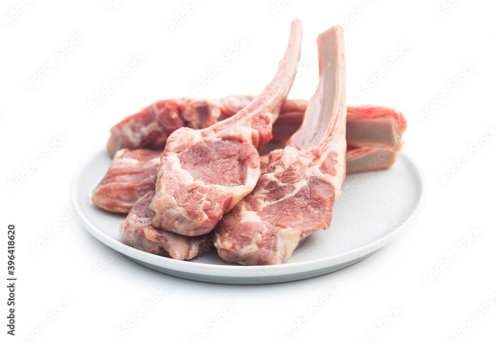 Slices raw lamb chops on plate Slices raw lamb chops on plate