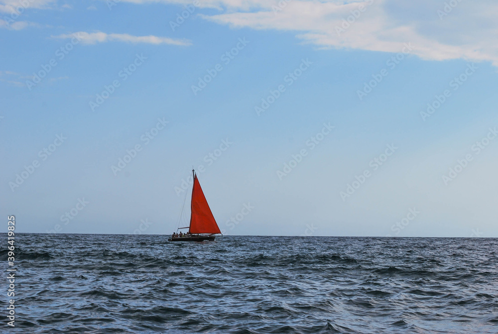 boat with red sail