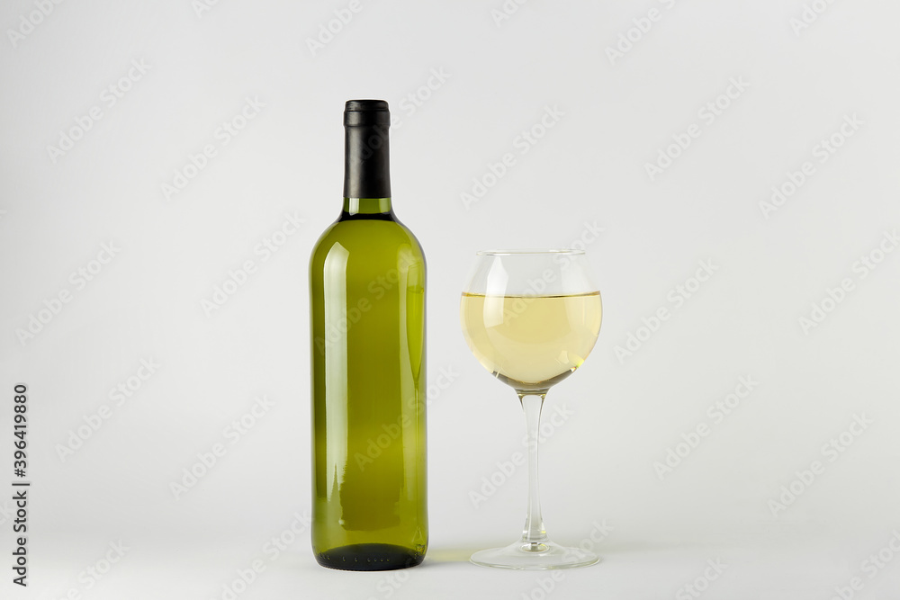 Green wine bottle with white wine isolated on white