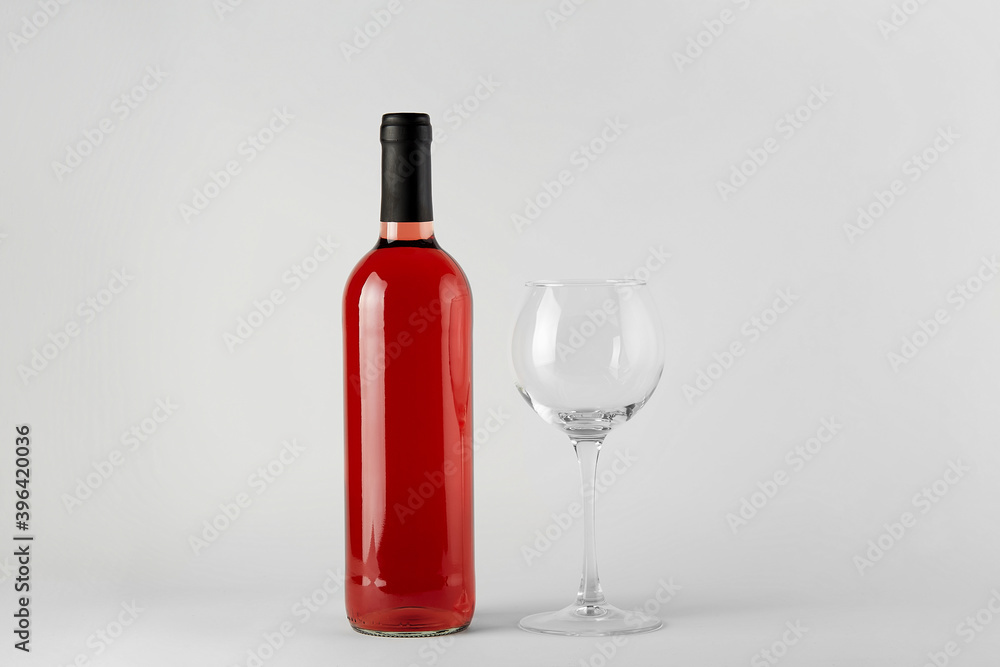 Red wine bottle with rose wine isolated on white Red wine bottle with rose wine isolated on white