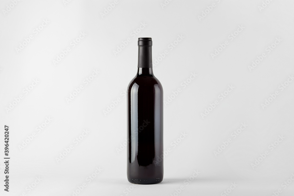 Black wine bottle with red wine isolated on white Black wine bottle with red wine isolated on white