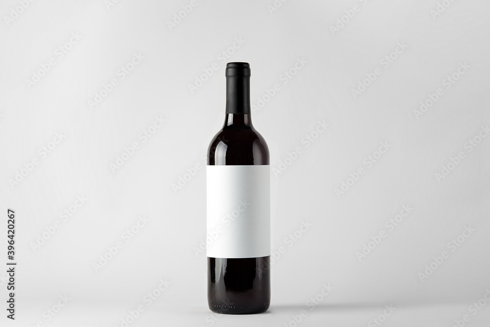 Black wine bottle with red wine isolated on white Black wine bottle with red wine isolated on white