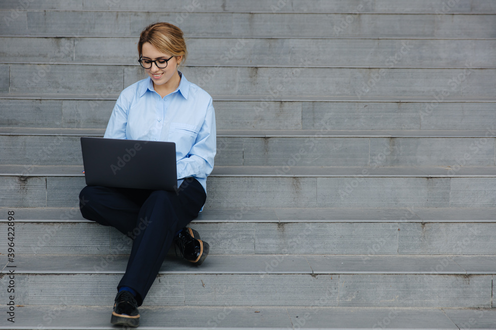 Woman working on laptop on fresh air Woman working on laptop on fresh air