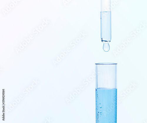 a drop of liquid drips into the test tube