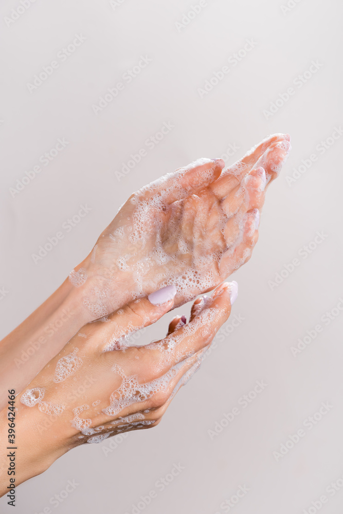 cropped of woman washing hands isolated on grey cropped of woman washing hands isolated on grey