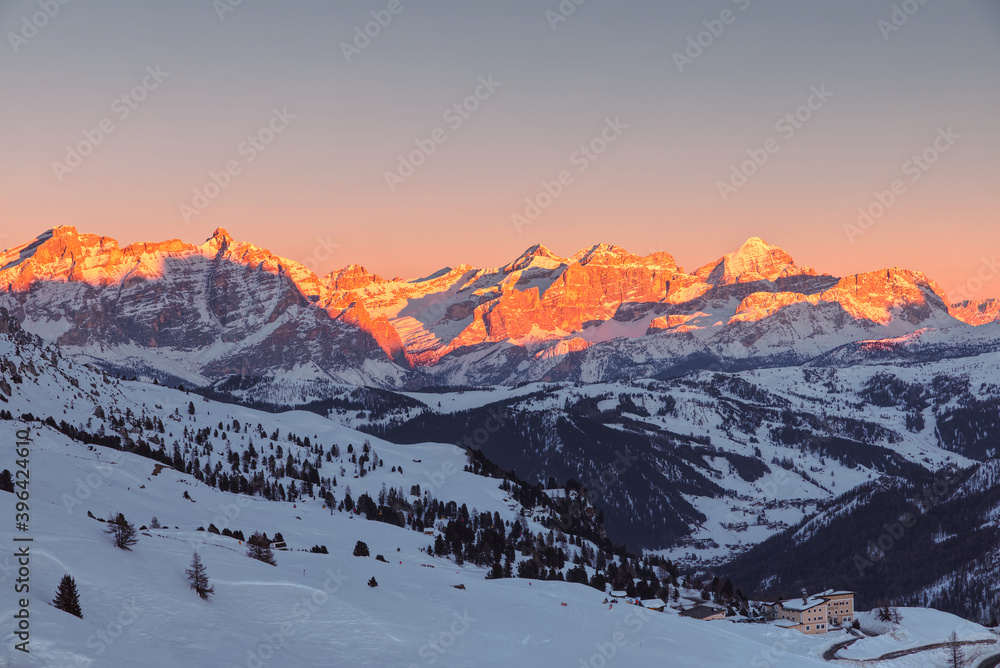 Sunset with golden peaks in Dolomiti Superski resort, Alps,Italy