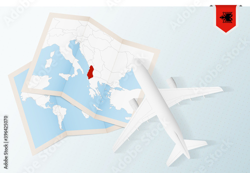 Travel to Albania, top view airplane with map and flag of Albania.