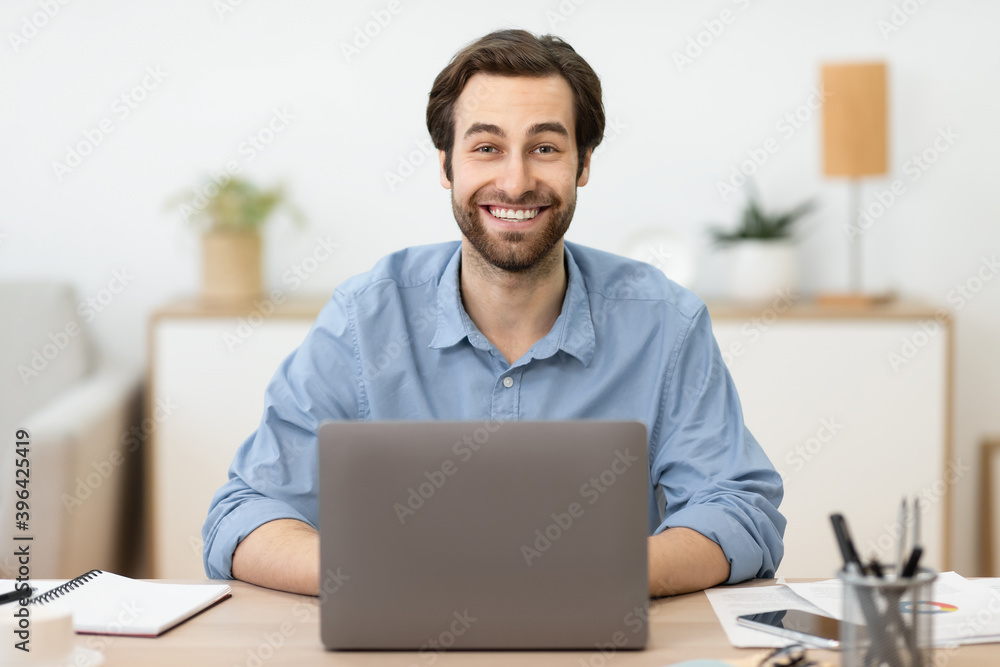 Excited Businessman At Laptop Working Online Posing In Home Office Excited Businessman At Laptop Working Online Posing In Home Office