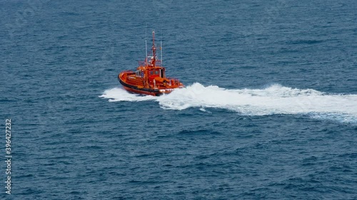 TENERIFE, CANARY ISLANDS, ATLANTIC OCEAN, SPAIN, NOVEMBER 23, 2020: Rescue Boat in the ocean off the coast of Los Cristianos. Real situation, search for bodies of missing people.