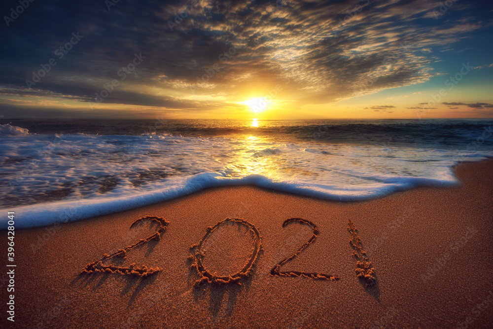 Happy New Year 2021 concept, lettering on the beach. Sea sunrise - obrazy, fototapety, plakaty 
