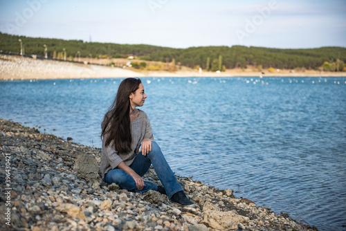 Autumn. A dreamy attractive woman gazes dreamily at the horizon.