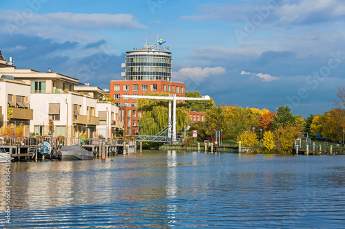 Harbor basin Tegeler Hafen with the clinic Medical Park Humboldtmuehle, residential units and a footbridge in Berlin