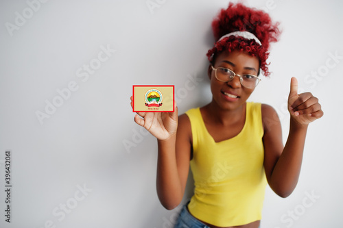 African woman with afro hair hold Ekiti flag isolated on white background, show thumb up. States of Nigeria concept. photo