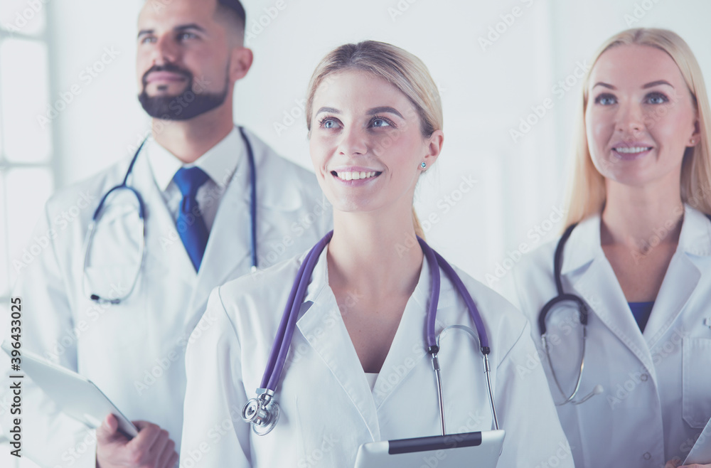 Fototapeta premium Smiling doctors all standing together as they work