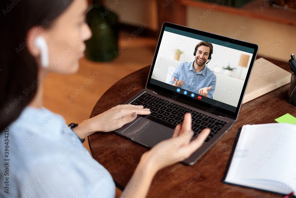 Woman using laptop and making video call with boss Woman using laptop and making video call with boss