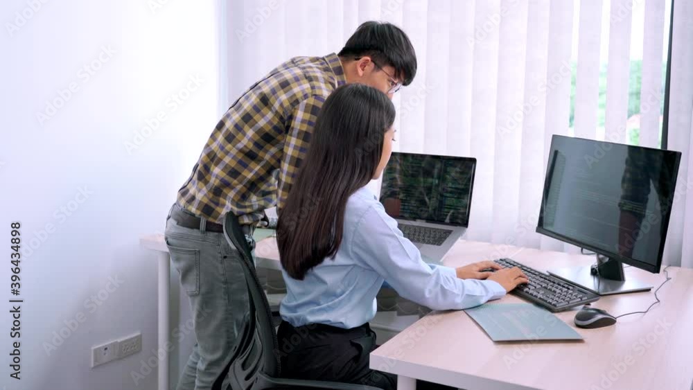 Asian Outsource Software engineer Developer Team Working Code to find solution to problem In Modern Office, Startup business group working as team concept Asian Outsource Software engineer Developer Team Working Code to find solution to problem In Modern Office, Startup business group working as team concept