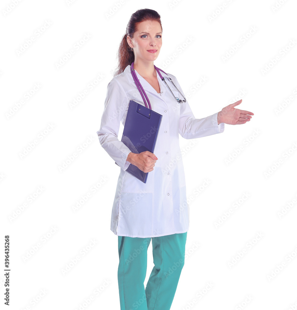 Smiling female doctor with a folder in uniform standing at hospital. Smiling female doctor Smiling female doctor with a folder in uniform standing at hospital. Smiling female doctor