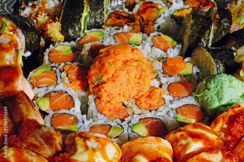 Platter of sushi maki rolls with spicy tuna
