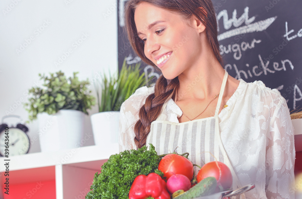 Young woman cooking in the kitchen. Young woman