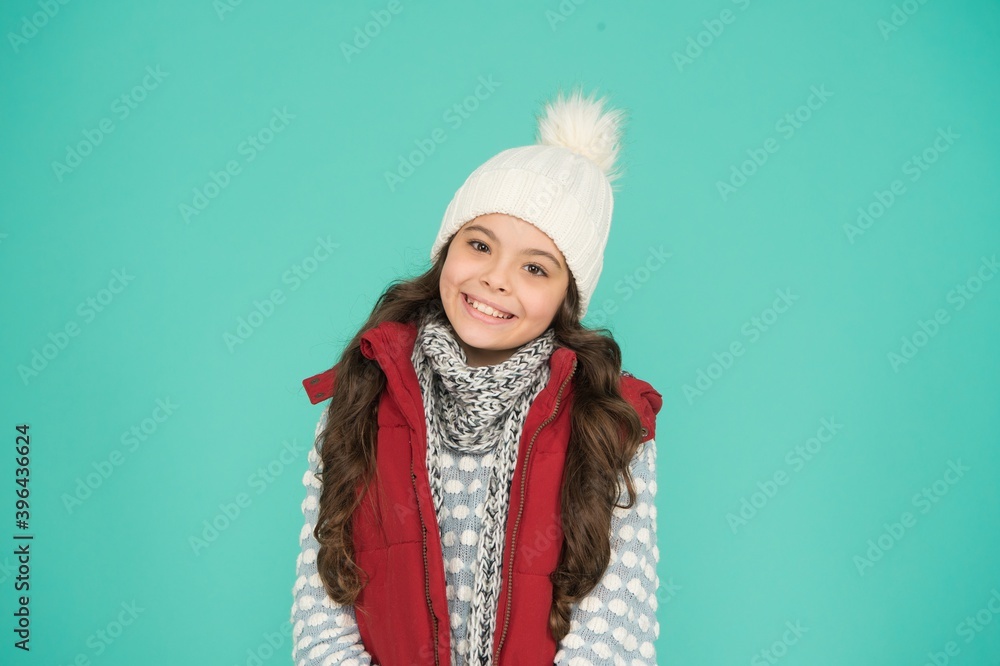 Warm smiles. warm clothes at wintertime season. cold weather forecast. kid fashion and shopping. xmas time. ready for new year vacation. no hypothermia. cheerful girl wearing layers of clothing Warm smiles. warm clothes at wintertime season. cold weather forecast. kid fashion and shopping. xmas time. ready for new year vacation. no hypothermia. cheerful girl wearing layers of clothing