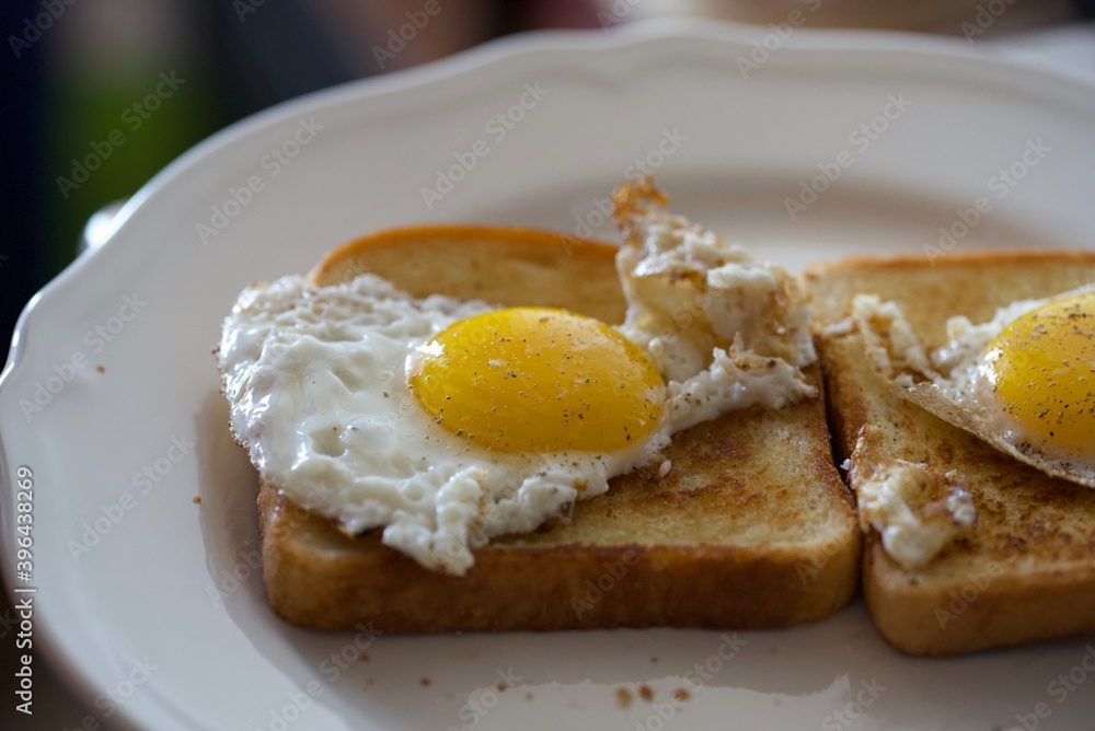 Eggs in a basket - Fried Eggs on Toast ready for breakfast Eggs in a basket - Fried Eggs on Toast ready for breakfast
