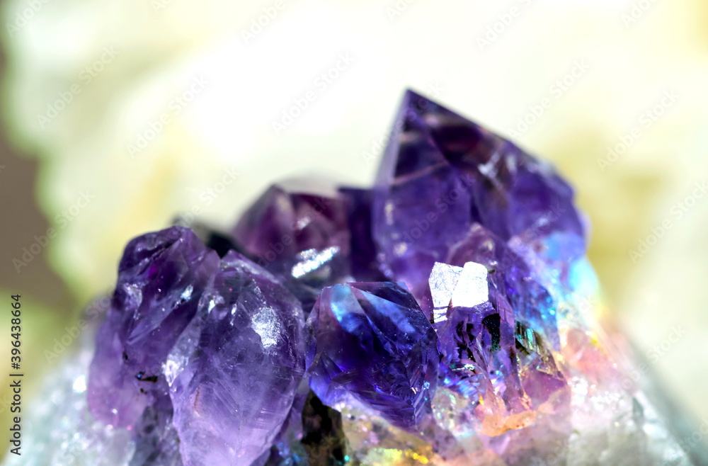 Beautiful crystal magic amethyst gem stone. Texture of specimen with scattered natural light effect. Beautiful crystal magic amethyst gem stone. Texture of specimen with scattered natural light effect.