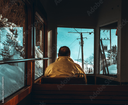 person in the window of a tram