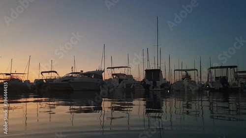 Marina Sveva touristic port at sunset. Panning photo