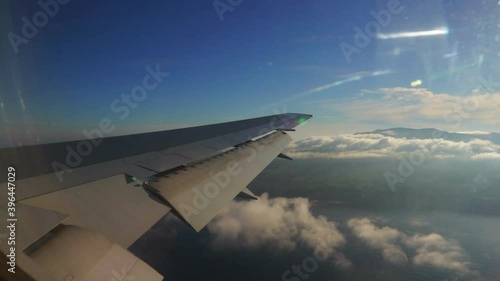 Airplane wing with São Migel's island in the Azores on the background photo