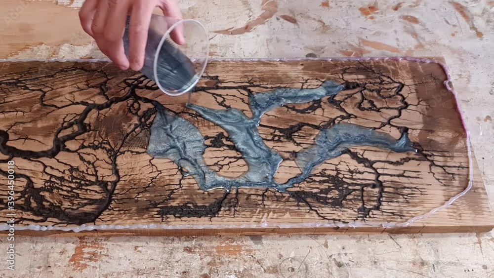 Pouring Epoxy Resin on burned wood with holes to make cutting board