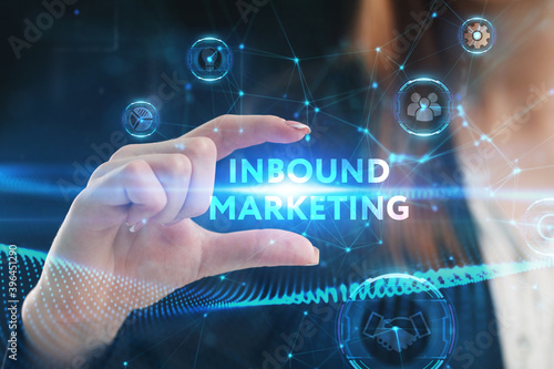 Business, Technology, Internet and network concept. Young businessman working on a virtual screen of the future and sees the inscription: Inbound marketing
