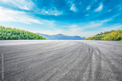 Asphalt road and green mountain with bamboo forest natural landscape.