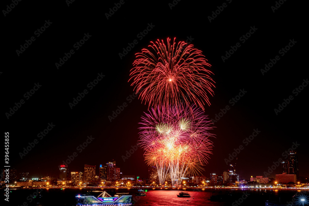 Silhouette people come to join celebration day with beautiful firework sparkle colorful in the sky on firework festival Silhouette people come to join celebration day with beautiful firework sparkle colorful in the sky on firework festival