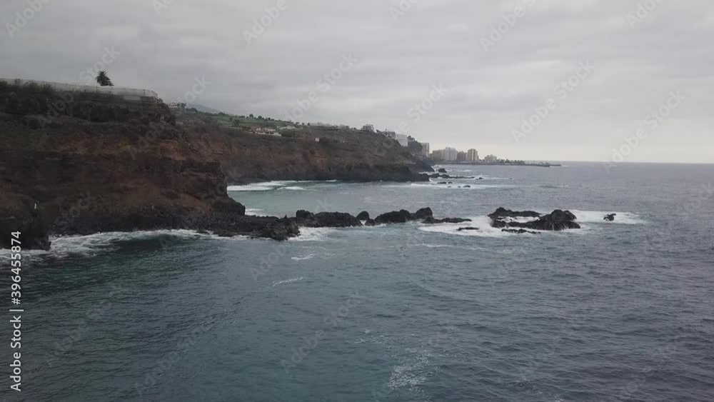 Aerial view of waves crashing onto a black beach in Tenerife Aerial view of waves crashing onto a black beach in Tenerife