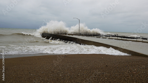 Huge waves crash against a break wall on a windy day at Tower Beach in Winnetka, Illinois, on the western shore of Lake Michigan. photo