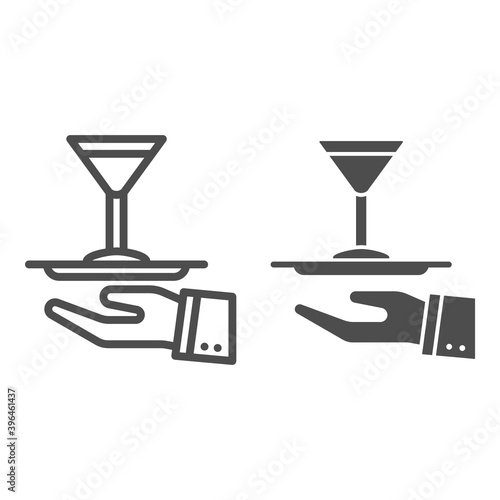 Cocktail on a tray line and solid icon, Bartenders Day concept, Serving drink sign on white background, Waiter hand holding tray with martini glass icon in outline style for mobile. Vector graphics.