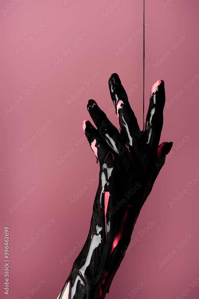partial view of hand with dripping black paint isolated on pink, stock image partial view of hand with dripping black paint isolated on pink, stock image