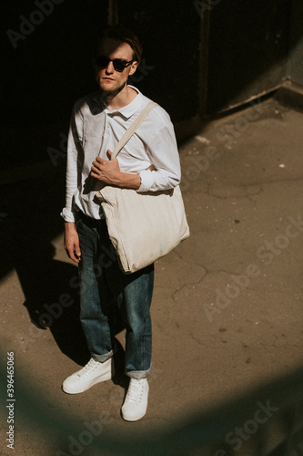 Casual man with eco tote bag