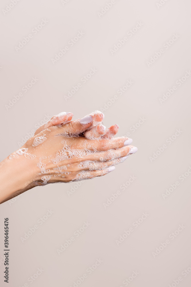 Fototapeta premium cropped of woman washing hands isolated on grey