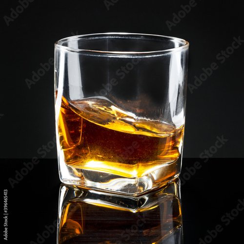 Fototapeta Whiskey served neat in a glass