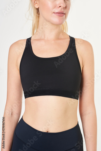 Blonde woman in a black sports bra mockup